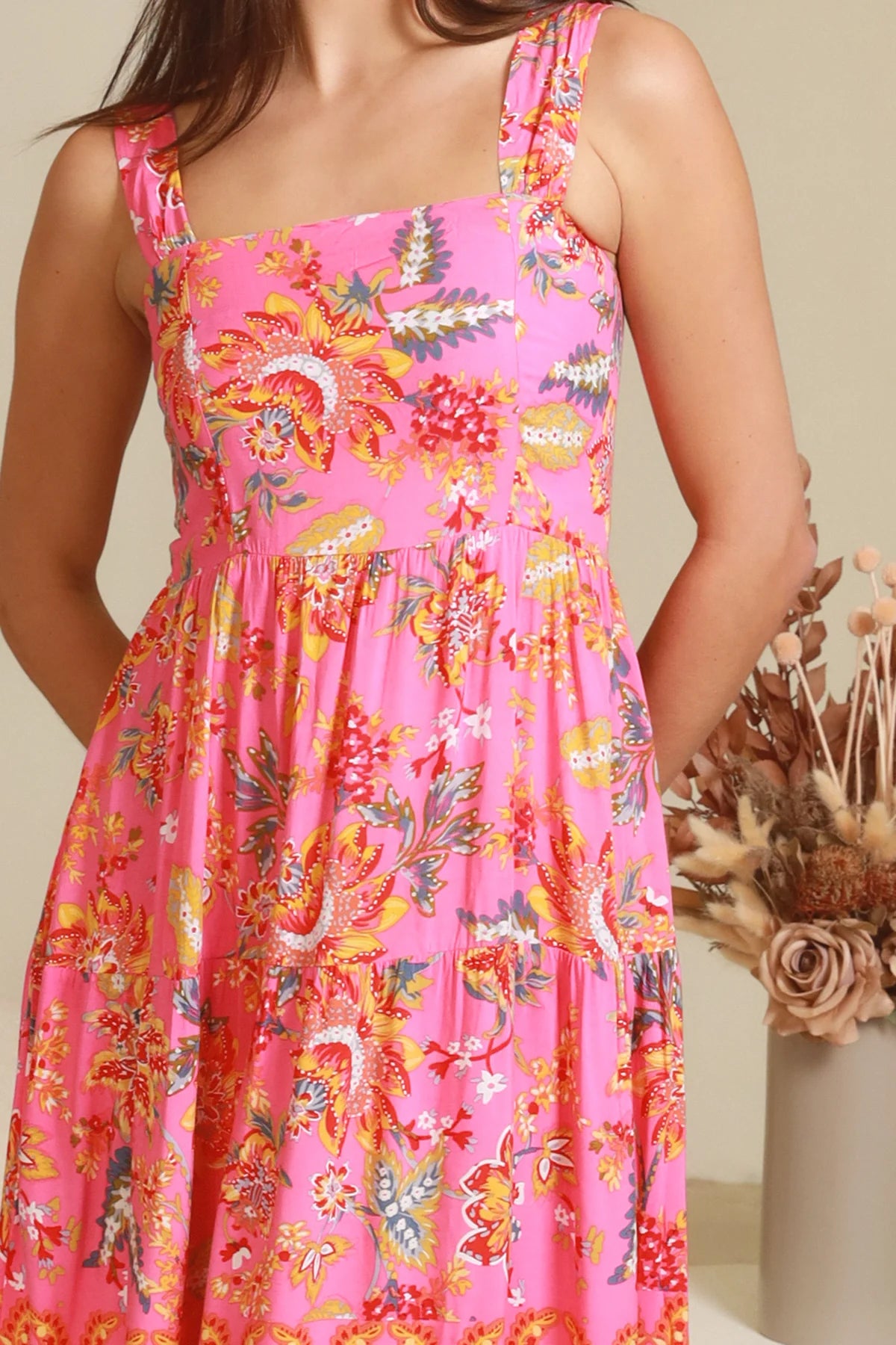 Imogen tiered floral maxi dress in pink bohemian print with fitted bodice, tie back straps and oversized tiered skirt Australia