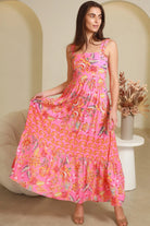 Imogen tiered floral maxi dress in pink bohemian print with fitted bodice, tie back straps and oversized tiered skirt Australia