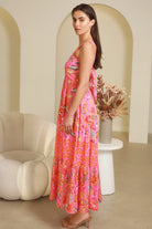 Imogen tiered floral maxi dress in pink bohemian print with fitted bodice, tie back straps and oversized tiered skirt Australia