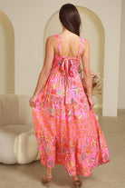 Imogen tiered floral maxi dress in pink bohemian print with fitted bodice, tie back straps and oversized tiered skirt Australia