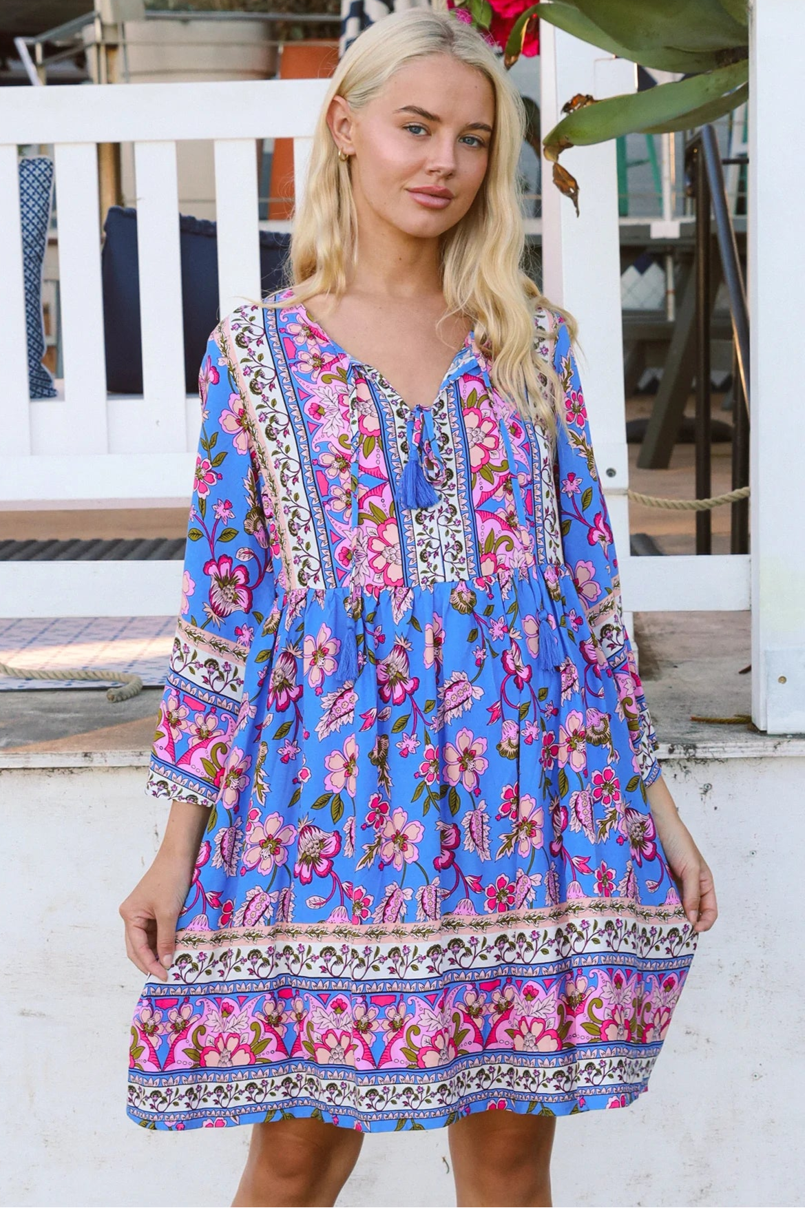 Bluebell riviera mini dress in seaside blue with picturesque florals tassel neckline and bell sleeves - boho mini dress Australia