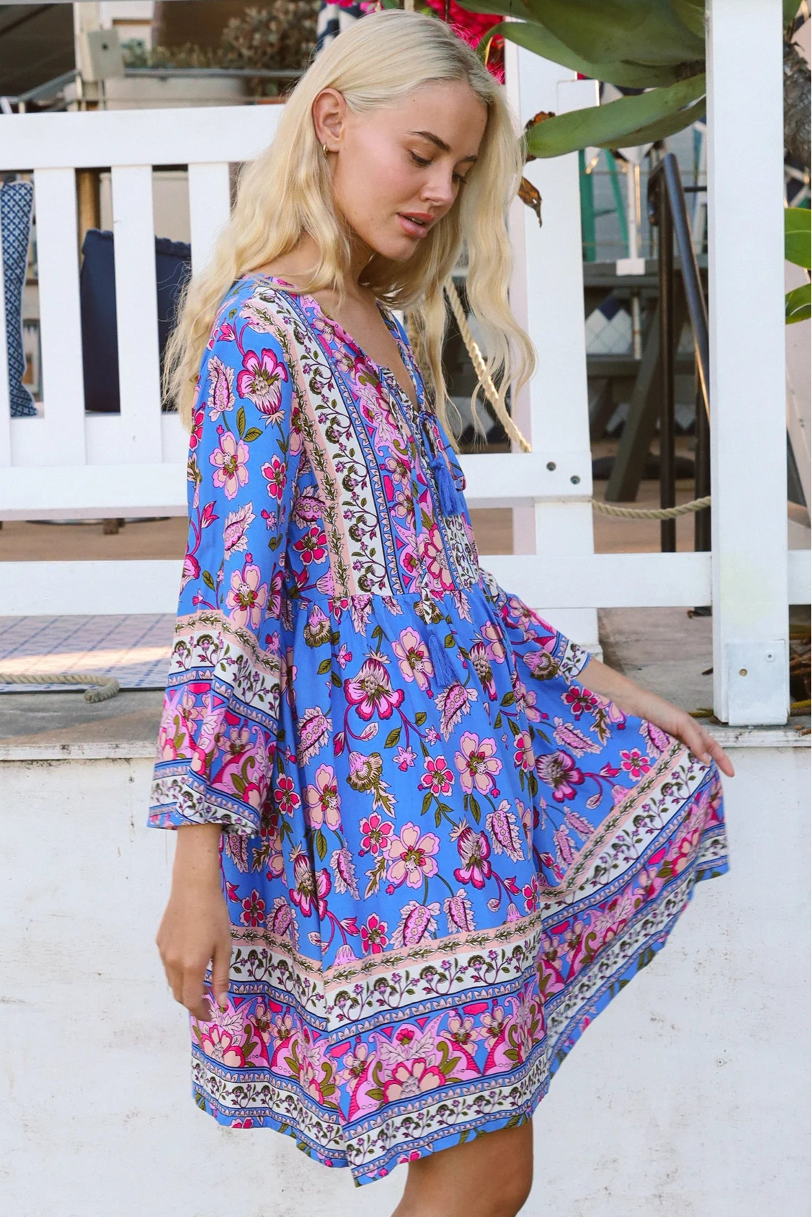 Bluebell riviera mini dress in seaside blue with picturesque florals tassel neckline and bell sleeves - boho mini dress Australia
