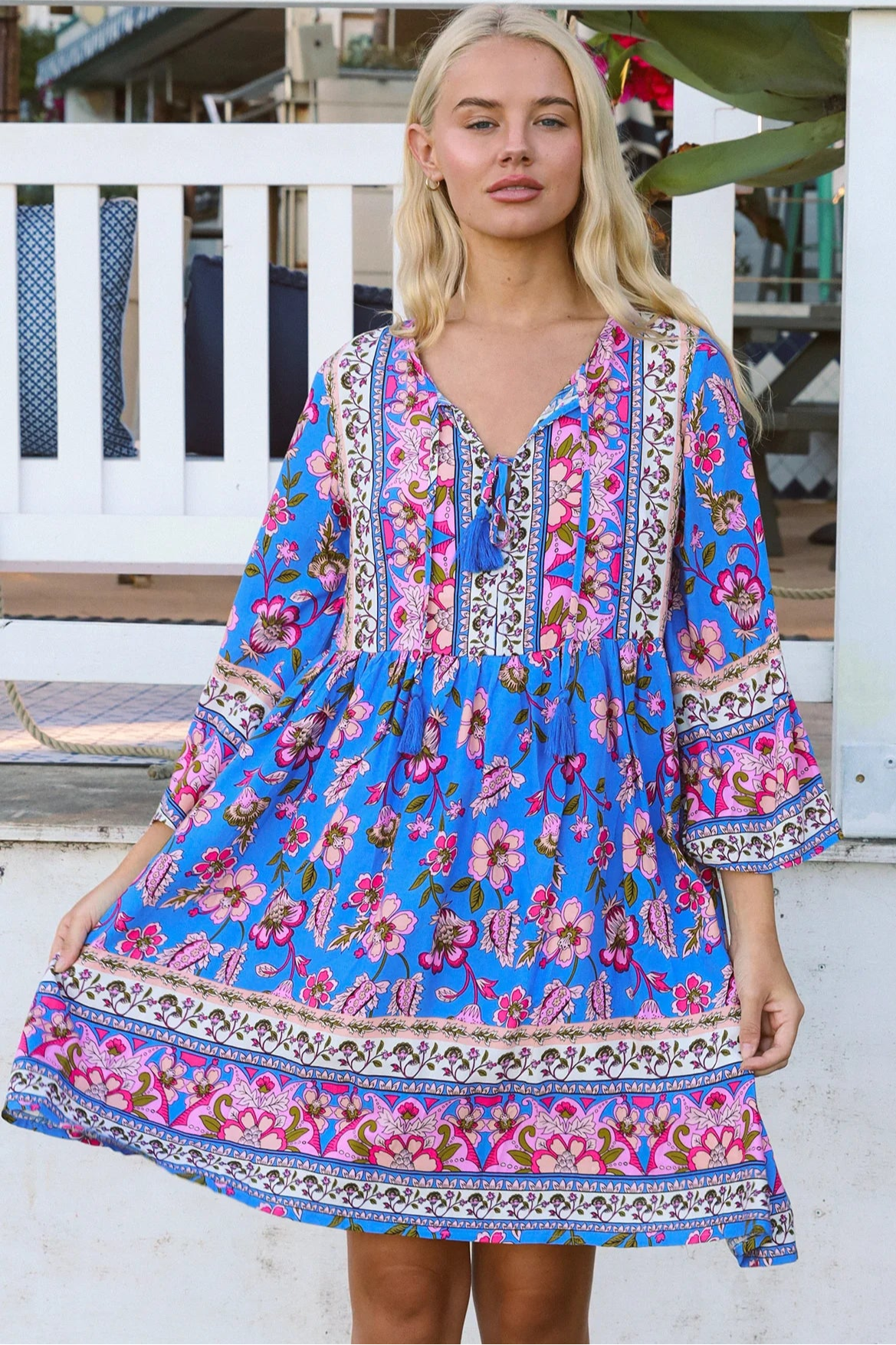 Bluebell riviera mini dress in seaside blue with picturesque florals tassel neckline and bell sleeves - boho mini dress Australia