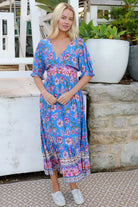 Indigo Periwinkle boho midi dress in rayon with pink and lilac florals and border-print frill hemline - Bluebell Riviera