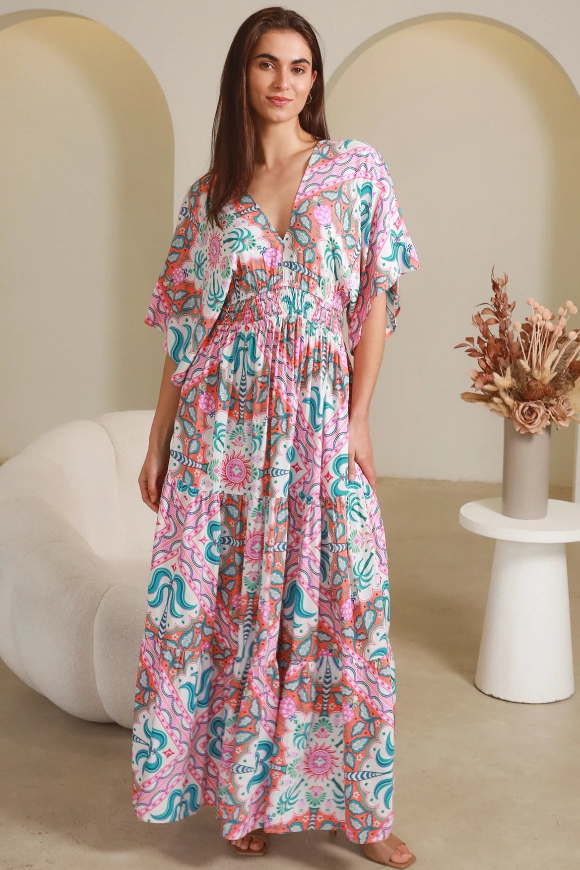 Model twirling in Fiorella Maxi Bohemian dress with pink aqua coral teal print — Dreamcatcher Dresses Australia