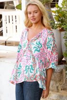 Model wearing Fiorella Boho Top in pink aqua coral teal print with voluminous sleeves - boho blouse Australia