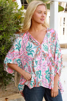 Model wearing Fiorella Boho Top in pink aqua coral teal print with voluminous sleeves - boho blouse Australia