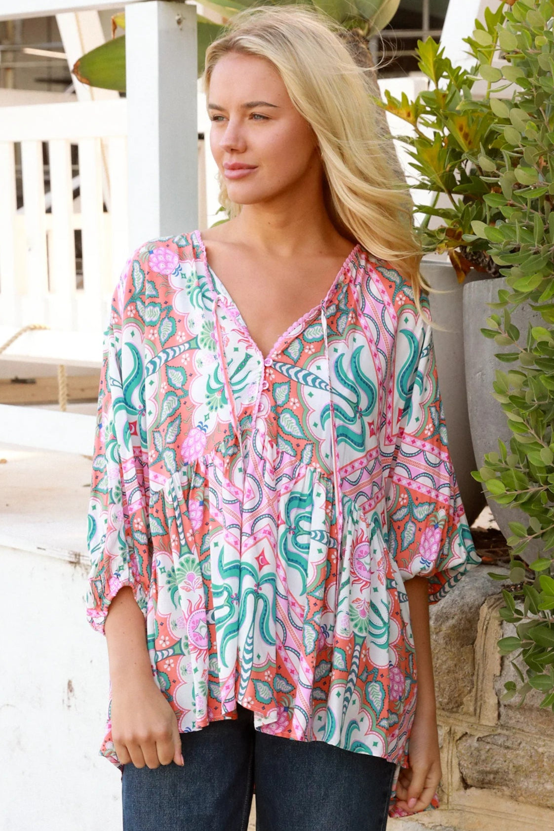 Model wearing Fiorella Boho Top in pink aqua coral teal print with voluminous sleeves - boho blouse Australia