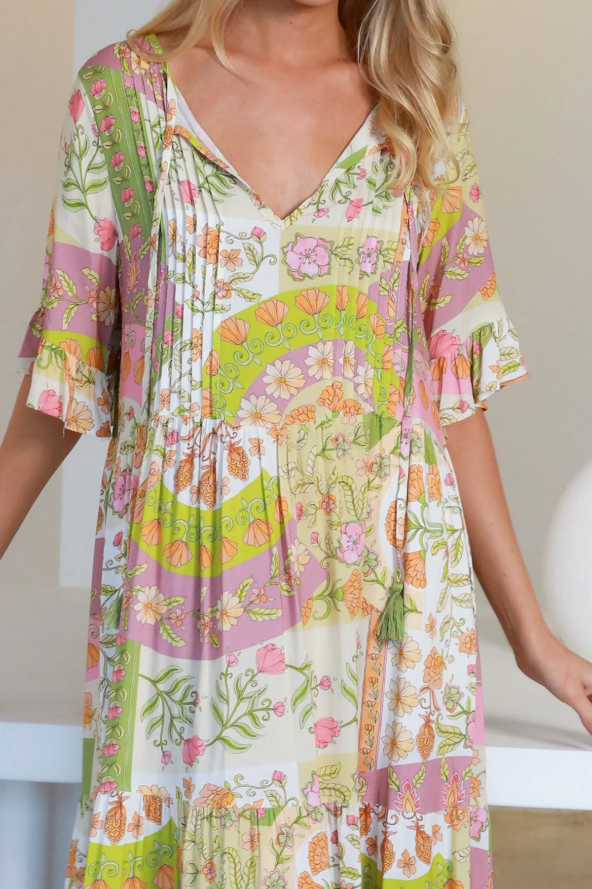 “Woman in vintage floral boho midi-maxi dress with tassel ties, frilled sleeves and tiered skirt – boho midi dresses Australia”