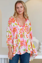 White floral rayon peplum boho blouse with v-neck beaded ties and soft elastic sleeve - The Isla Grace Top