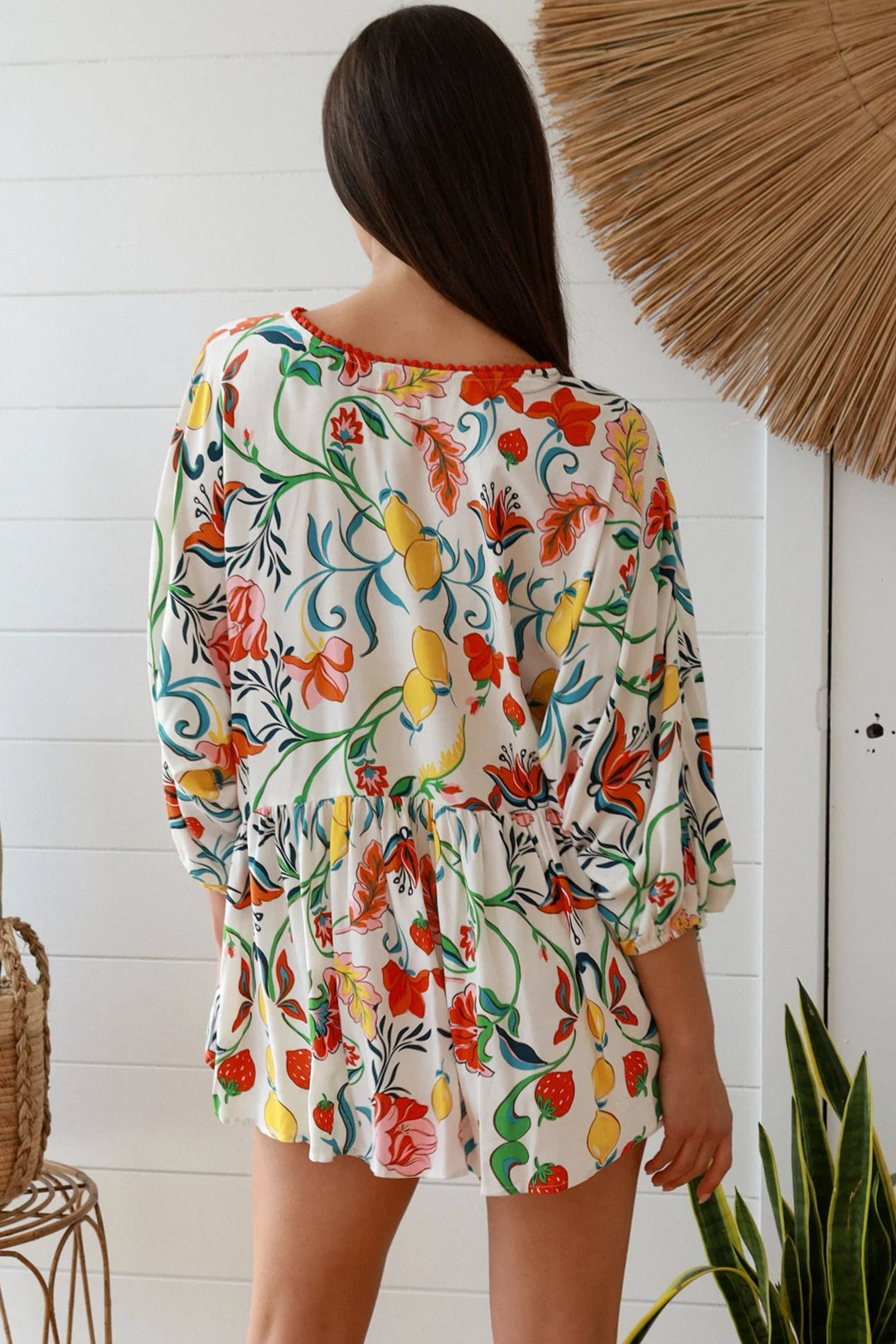 Boho floral print top with red and pink blossoms, relaxed fit, V-neckline with three-quarter sleeves - Australian bohemian fashion