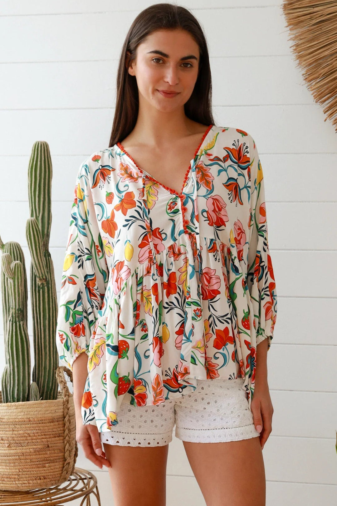 Boho floral print top with red and pink blossoms, relaxed fit, V-neckline with three-quarter sleeves - Australian bohemian fashion