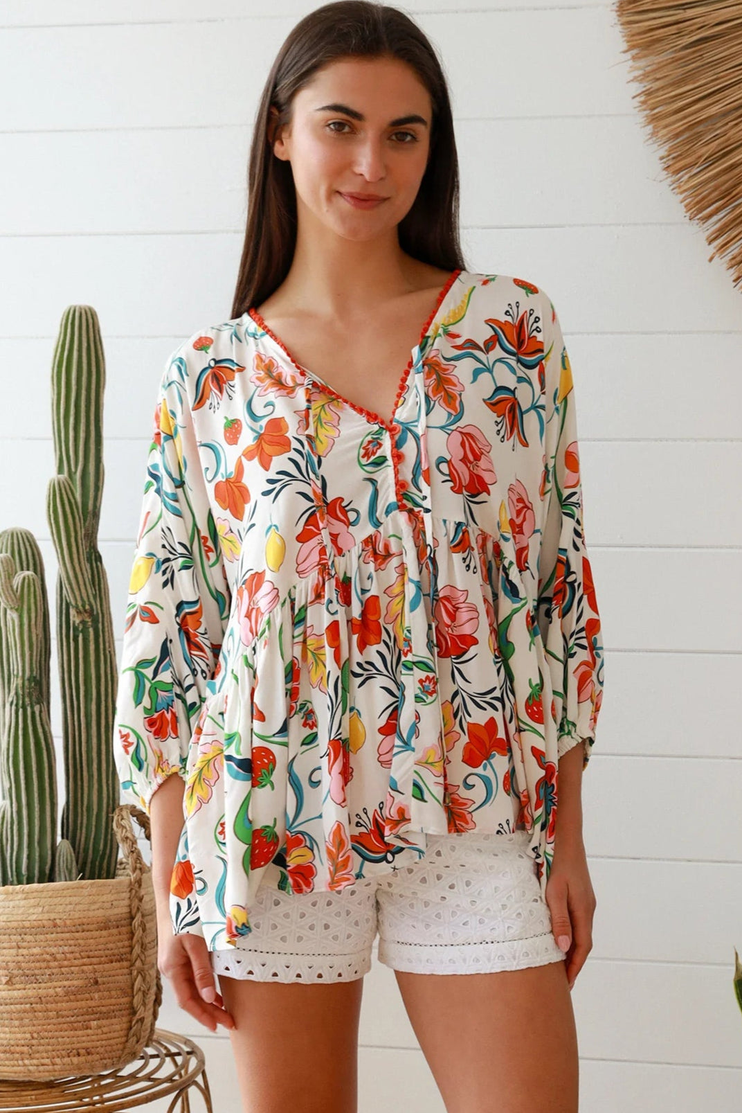 Boho floral print top with red and pink blossoms, relaxed fit, V-neckline with three-quarter sleeves - Australian bohemian fashion