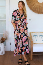 Black floral boho midi dress with painterly blooms, button front, frill hem, drawstring waist, half sleeves and pockets.