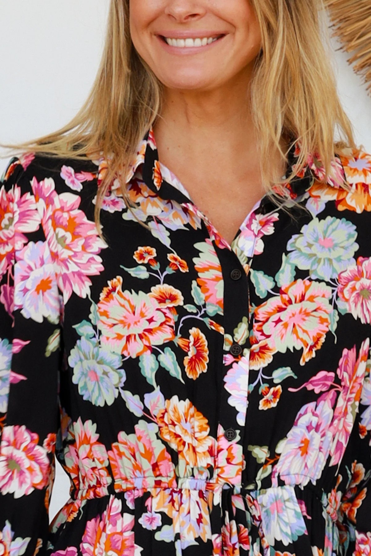 Black floral boho midi dress with painterly blooms, button front, frill hem, drawstring waist, half sleeves and pockets.