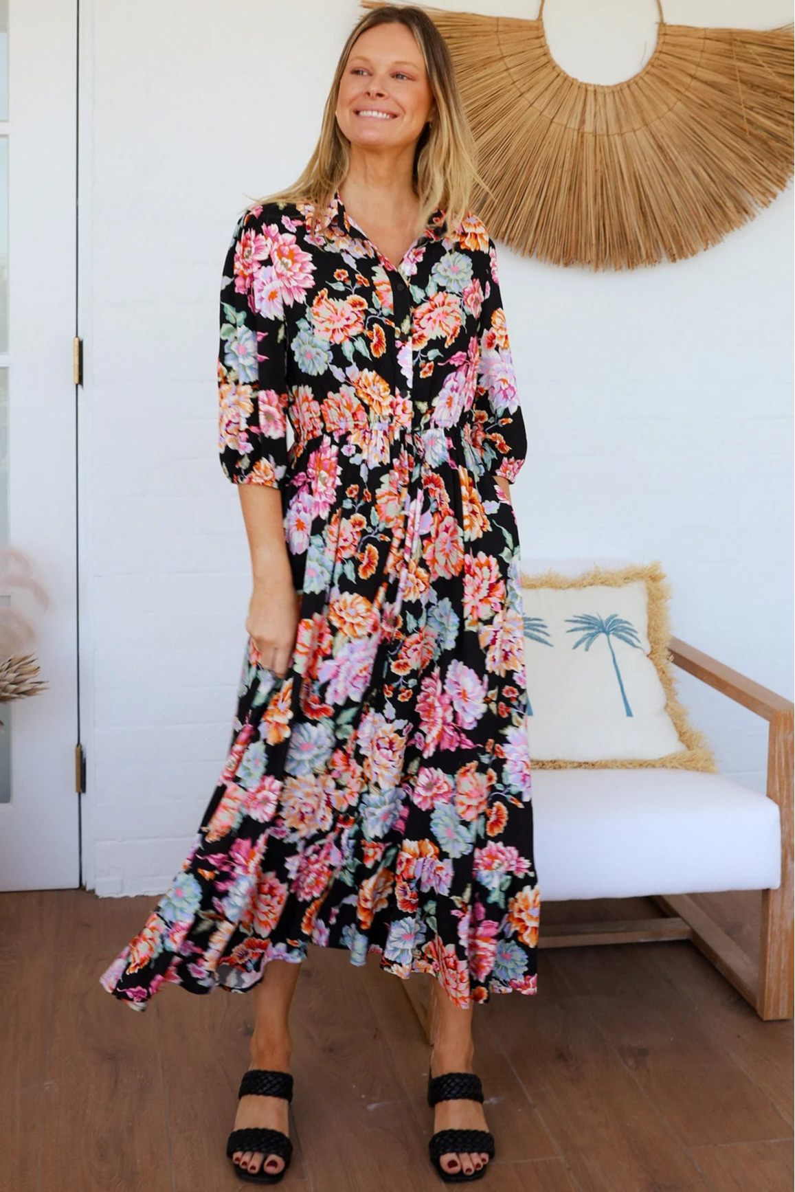 Black floral boho midi dress with painterly blooms, button front, frill hem, drawstring waist, half sleeves and pockets.