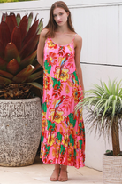 Pink floral slip maxi dress with poppy and parrot print, adjustable shoestring straps and crochet trim neckline