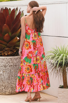 Pink floral slip maxi dress with poppy and parrot print, adjustable shoestring straps and crochet trim neckline