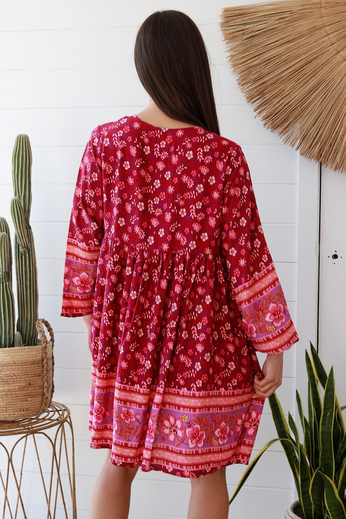 Raspberry floral bohemian mini dress with border print and flared sleeves Australian boho fashion