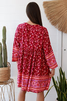 Raspberry floral bohemian mini dress with border print and flared sleeves Australian boho fashion