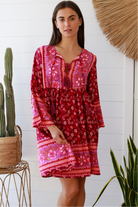 Raspberry floral bohemian mini dress with border print and flared sleeves Australian boho fashion