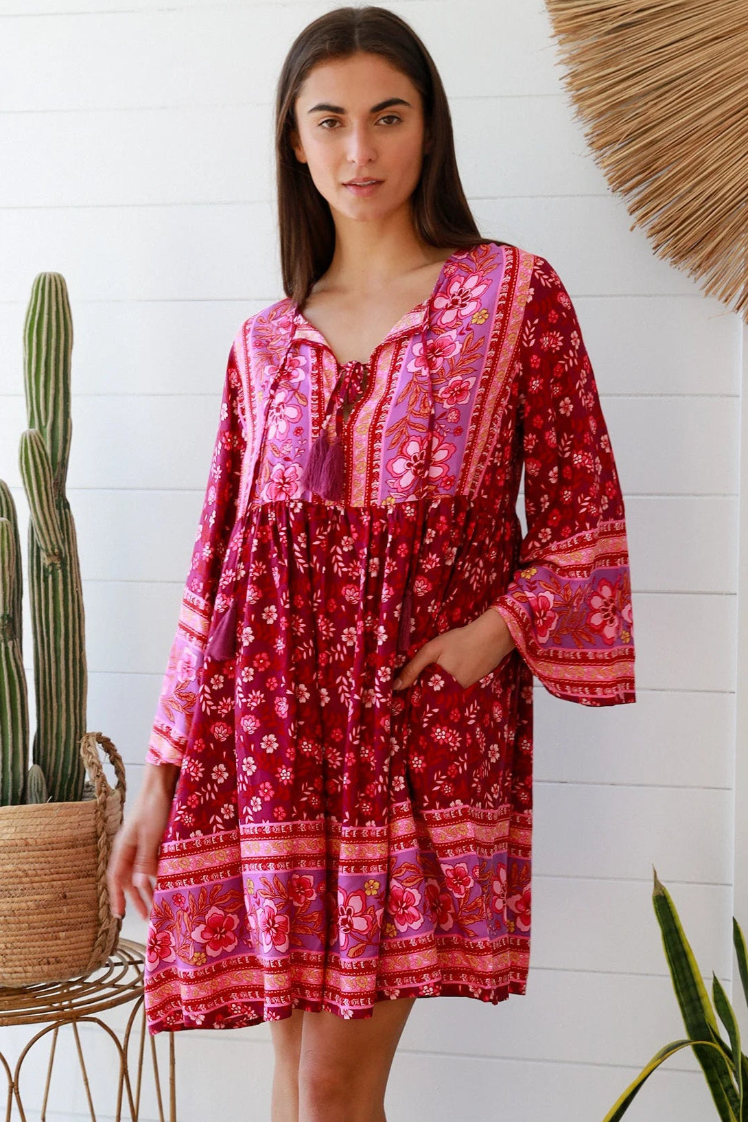 Raspberry floral bohemian mini dress with border print and flared sleeves Australian boho fashion