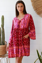 Raspberry floral bohemian mini dress with border print and flared sleeves Australian boho fashion