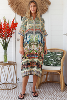 Woman wearing Oasis Kaftan Midi Dress in neutral geometric print with mosaic sleeve trim and petite collar – Peacock Feather Resort Collection