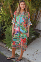 Wearing tropical viscose linen midi dress with flared sleeves and border print - Bohemian Love Runway 