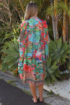 Wearing tropical viscose linen midi dress with flared sleeves and border print - Bohemian Love Runway 