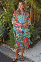 Wearing tropical viscose linen midi dress with flared sleeves and border print - Bohemian Love Runway 