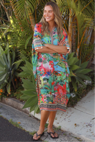 Wearing tropical viscose linen midi dress with flared sleeves and border print - Bohemian Love Runway 