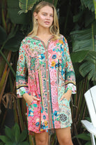 “Woman in mint, coral and turquoise patchwork viscose crepe boho shirt mini dress by Peacock Feather – The Journey Shirt Mini Dress”