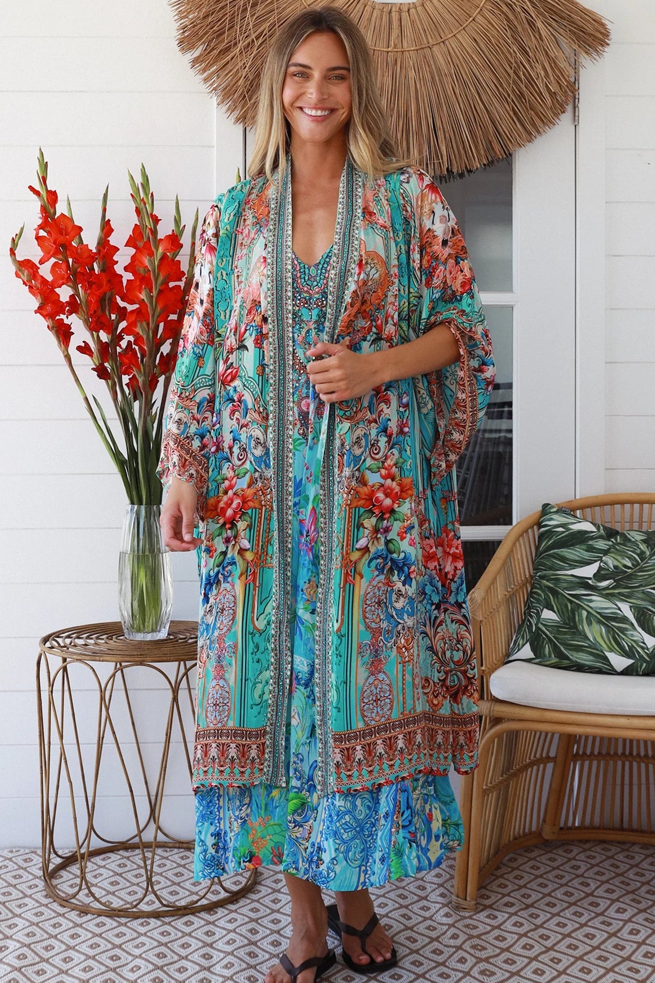 Woman in Lagoon Blue viscose - linen boho midi dress with beaded neckline from the Peacock Feather Resort Luxe Collection - Boho Dresses Australia 