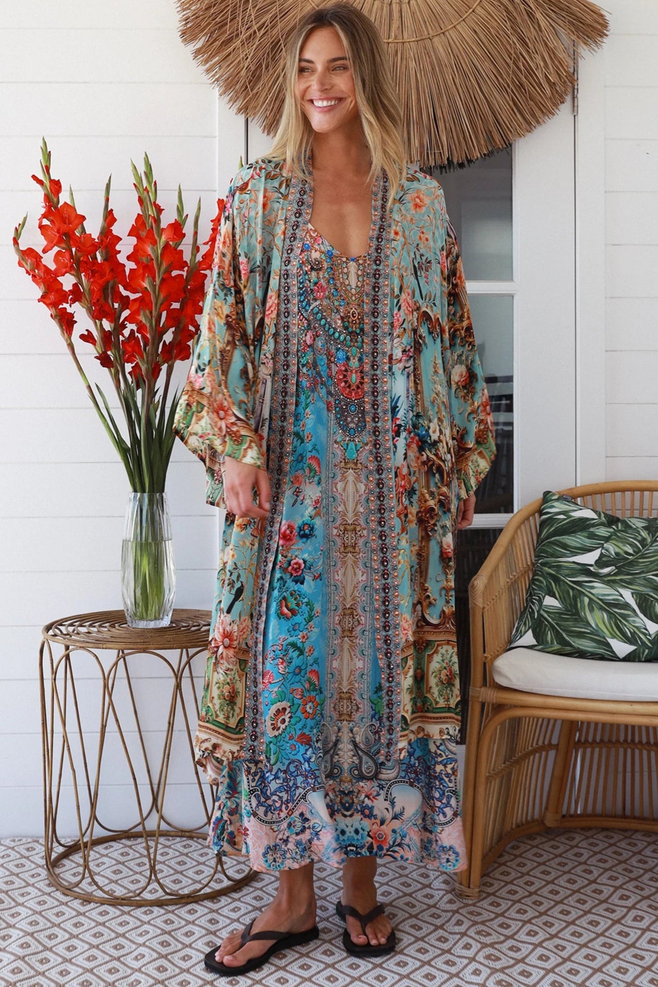 Woman wearing blue floral linen - viscose boho kimono with side splits - Peacock Feather Resort Luxe Australia.