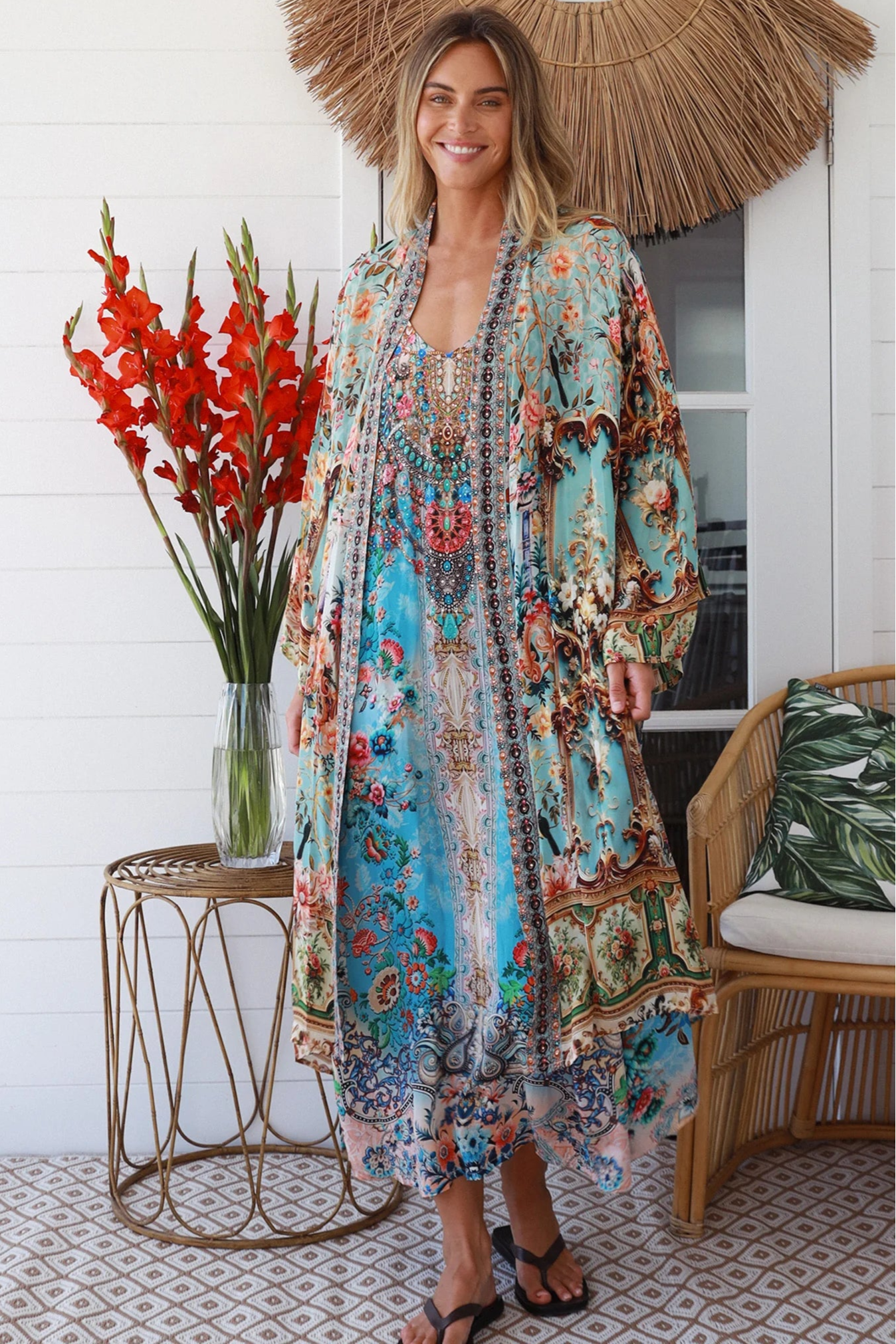 Woman wearing blue floral linen - viscose boho kimono with side splits - Peacock Feather Resort Luxe Australia.