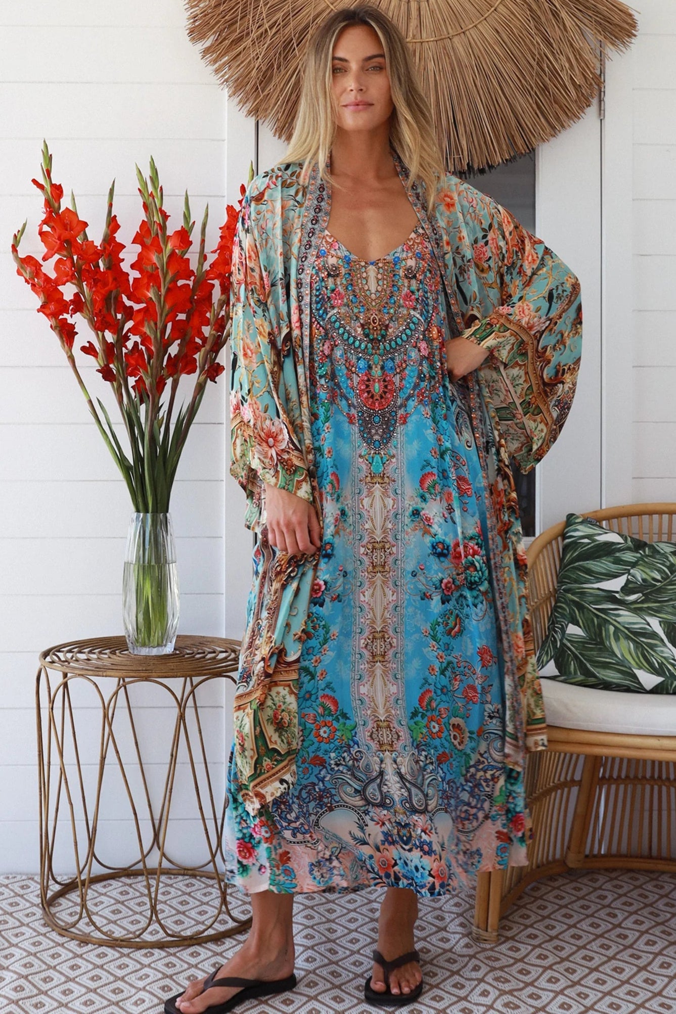 Woman wearing blue floral linen - viscose boho kimono with side splits - Peacock Feather Resort Luxe Australia.