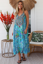 Woman in Lagoon Blue viscose - linen boho midi dress with beaded neckline from the Peacock Feather Resort Luxe Collection - Boho Dresses Australia 