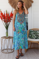 Woman in Lagoon Blue viscose - linen boho midi dress with beaded neckline from the Peacock Feather Resort Luxe Collection - Boho Dresses Australia 
