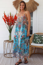 Woman wearing turquoise blue floral resort luxe midi dress with racerback straps - boho resort wear Australia