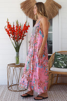 Woman in rose pink floral resort luxe midi dress with racerback straps - boho summer style Australia