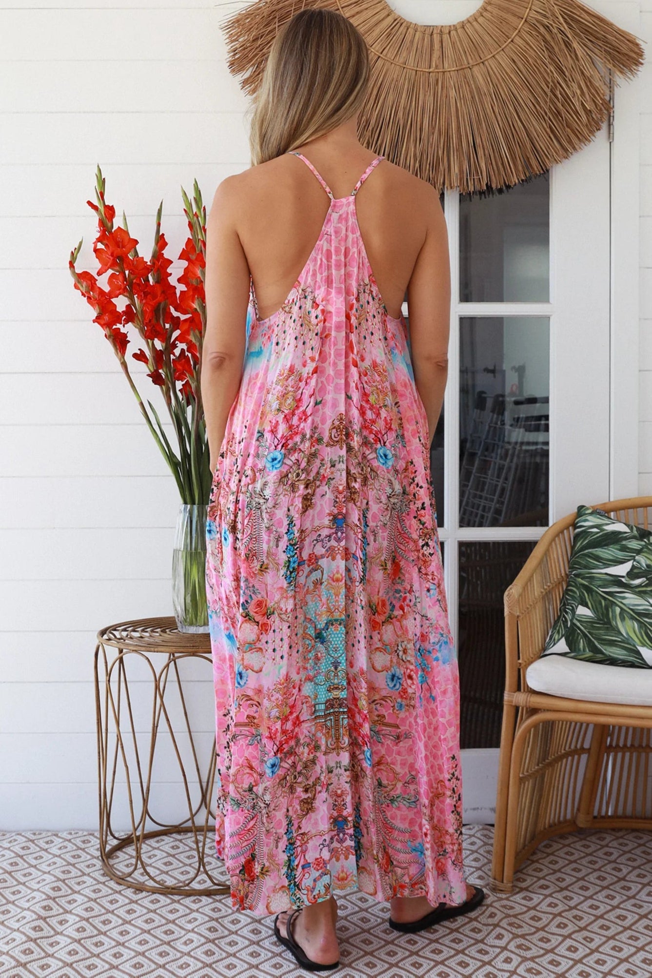 Woman in rose pink floral resort luxe midi dress with racerback straps - boho summer style Australia