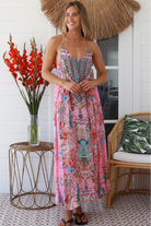 Woman in rose pink floral resort luxe midi dress with racerback straps - boho summer style Australia