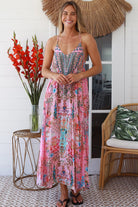 Woman in rose pink floral resort luxe midi dress with racerback straps - boho summer style Australia
