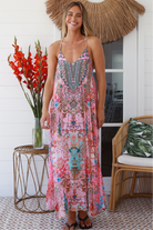Woman in rose pink floral resort luxe midi dress with racerback straps - boho summer style Australia