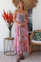 Woman in rose pink floral resort luxe midi dress with racerback straps - boho summer style Australia