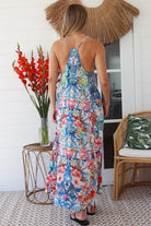 Woman in white boho midi dress with blue and coral floral mosaic print, racer back and adjustable straps - Australian boho fashion