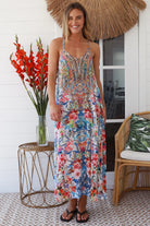 Woman in white boho midi dress with blue and coral floral mosaic print, racer back and adjustable straps - Australian boho fashion