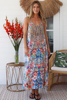 Woman in white boho midi dress with blue and coral floral mosaic print, racer back and adjustable straps - Australian boho fashion