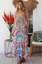 Woman in white boho midi dress with blue and coral floral mosaic print, racer back and adjustable straps - Australian boho fashion